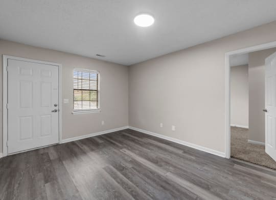 living room with faux wood flooring at Bennett, Greenville, NC, 27858