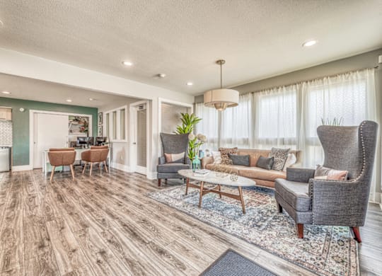 Open living space with wood style flooring at Northwood Heights Apartments, Dallas, 75248