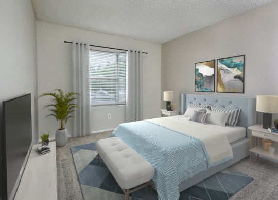 a bedroom with a large bed and a tv