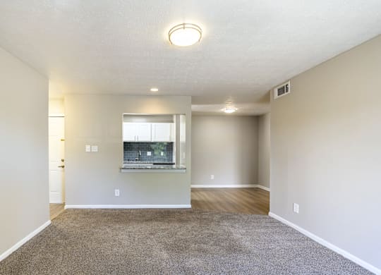 A room with a window and a door.