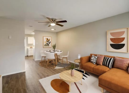 a living room and dining room with a couch and a table