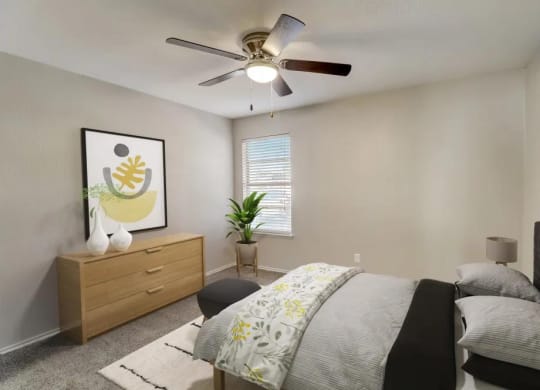 a bedroom with a bed and a ceiling fan