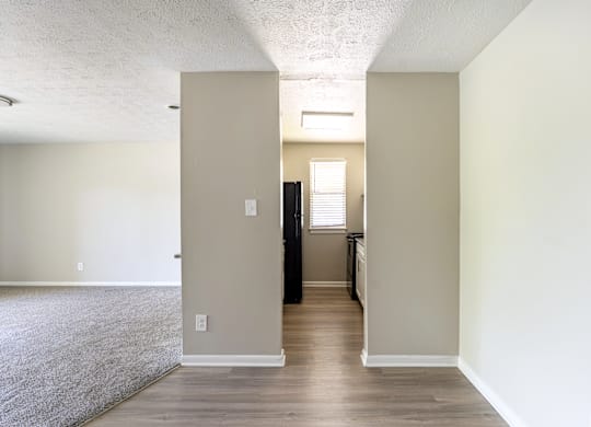 A room with a doorway leading to another room.