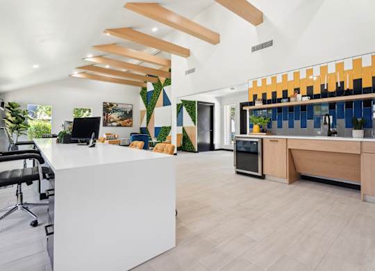 A modern office with a white reception desk and a black office chair. at Anson at North Hills, North Carolina, 27604