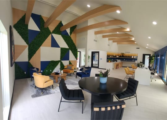 a view of the lobby of anson with tables and chairs