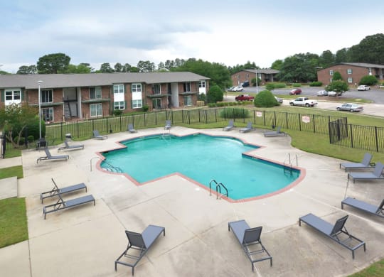pool with poolside seating at channing apartments in fayetteville nc