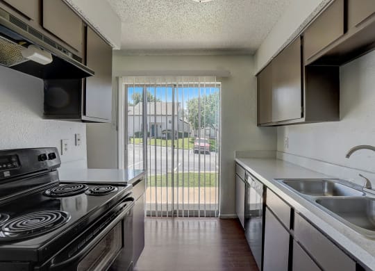 the preserve at ballantyne commons apartment kitchen with stainless steel appliances and a window