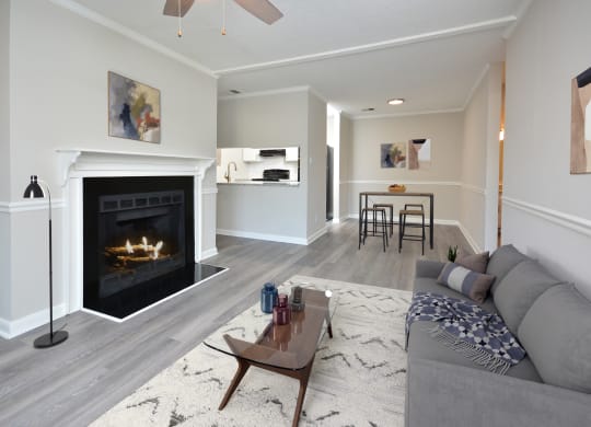 a living room with a fireplace and a couch