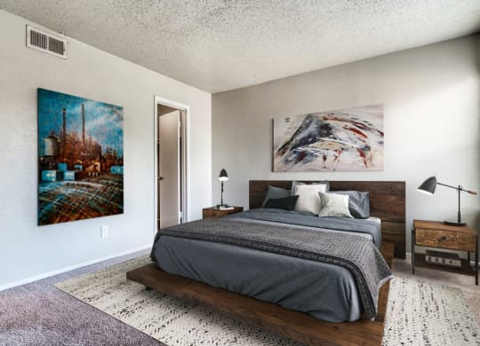a bedroom with a bed and a painting on the wall  at Shadow Ridge, Arlington, 76013