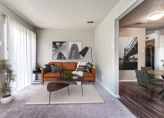 an open living room with a couch and a coffee table  at Shadow Ridge, Arlington, 76013