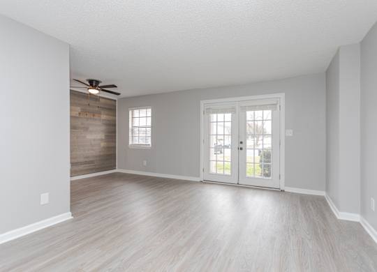A room with a sliding door and a ceiling fan.at Liberty Crossing, Jacksonville
