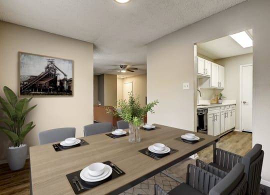 an open dining room and kitchen with a table and chairs