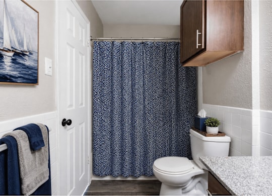 Bathroom with granite countertop and modern fixtures at Ridgeview Apartments, Sherman