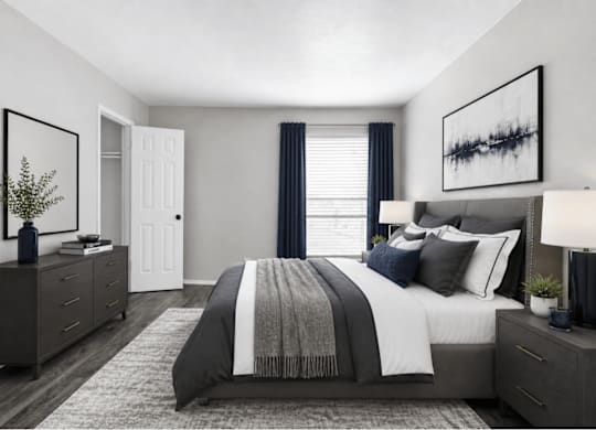 Spacious bedroom with upholstered bed and layered bedding at Ridgeview Apartments, Sherman, 75092