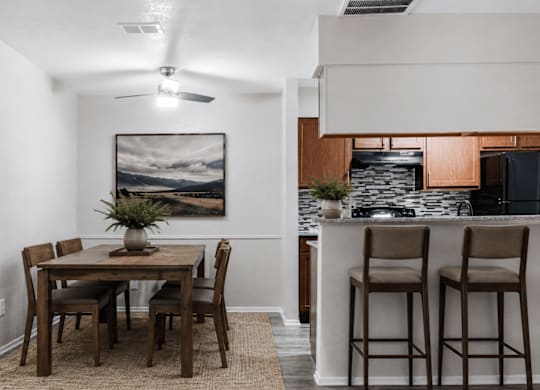 Dining area with breakfast bar and modern kitchen at Ridgeview Apartments, Texas