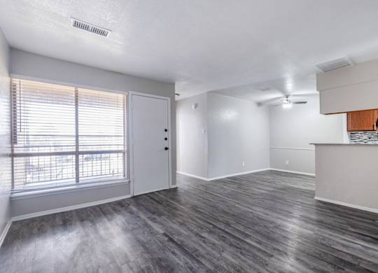 Open living space with vinyl plank flooring at Ridgeview Apartments, Sherman, TX 75092