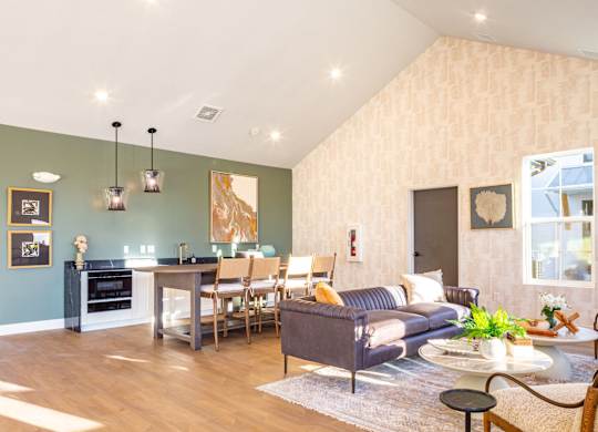 A living room with a grey couch and a coffee table.