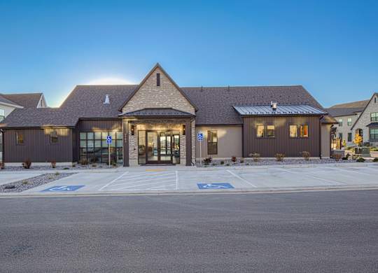A building with a parking lot in front of it.