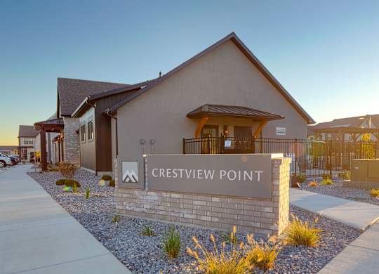 Crestview Point is a residential area with houses and a clear sky.