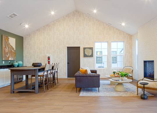 A living room with a brown couch and a wooden floor.