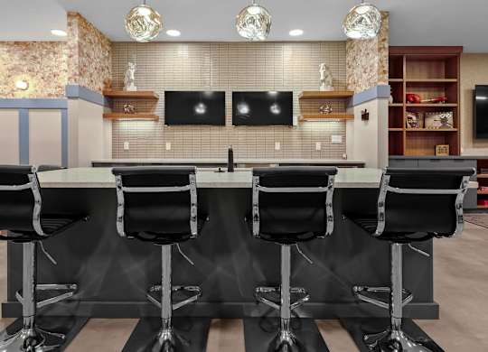 A conference room with a long table and chairs.