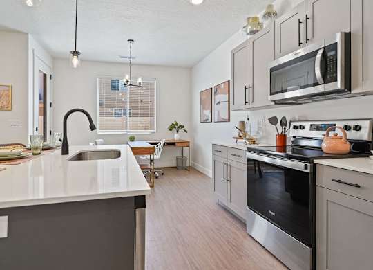 a kitchen with a sink and a microwave