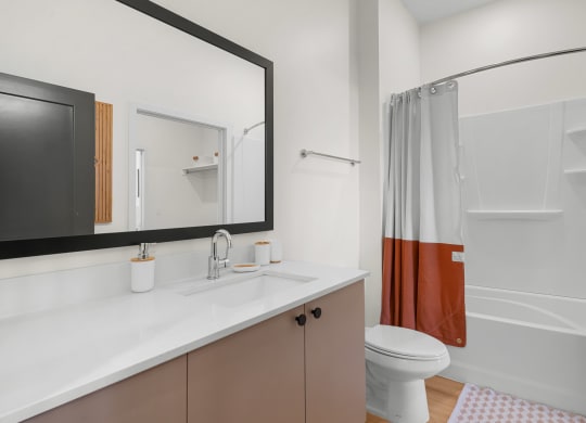 a modern bathroom with a large mirror