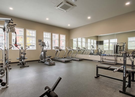 our apartments showcase a large fitness center with plenty of exercise equipment