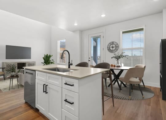 kitchen island and dining area at Crestview at Highland townhomes in Highland, UT