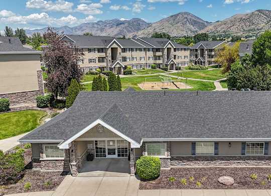 A house with a mountain view in the background.