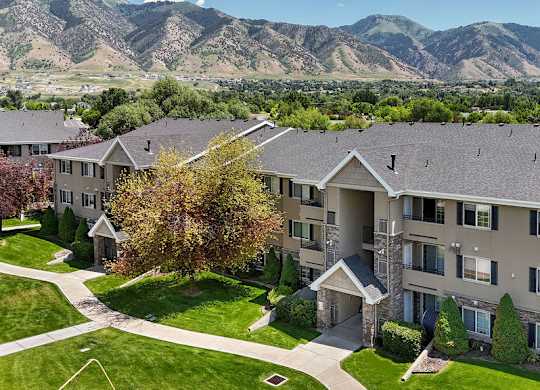 Apartment complex with a mountain range in the background.