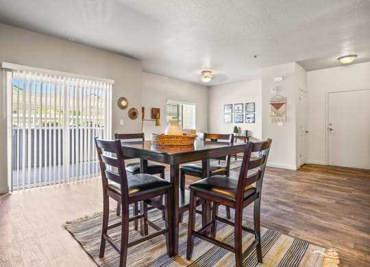 a dining room with a table and chairs