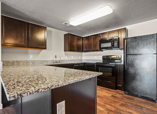 a kitchen with a granite counter top and