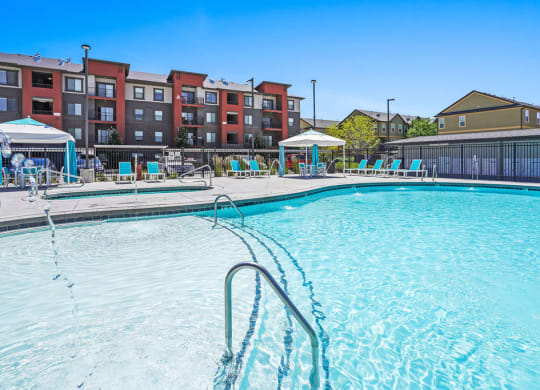 our apartments have a resort style pool with chaise lounge chairs