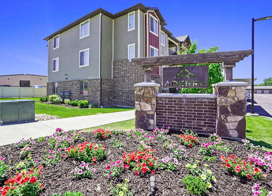 A building with a garden in front of it.