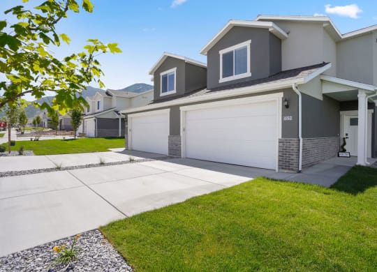 a house with a driveway and a garage door