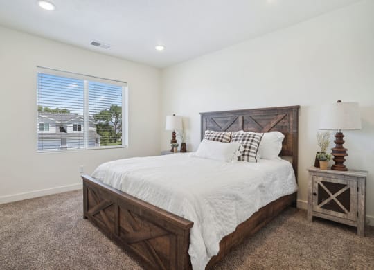 a bedroom with a bed and a window