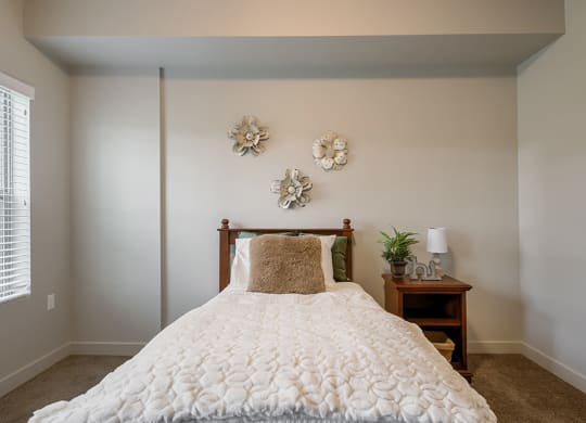 a bedroom with a bed and two night stands