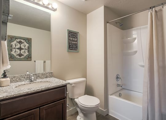 a bathroom with a bathtub toilet and sink