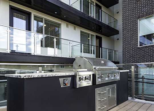 a barbecue grill in the middle of a patio