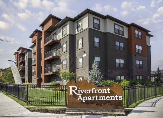 an apartment building with a sign that reads riverfront apartments