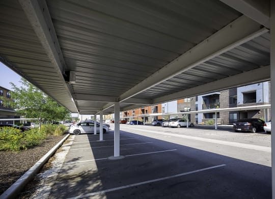 awning over a parking lot in front of a building