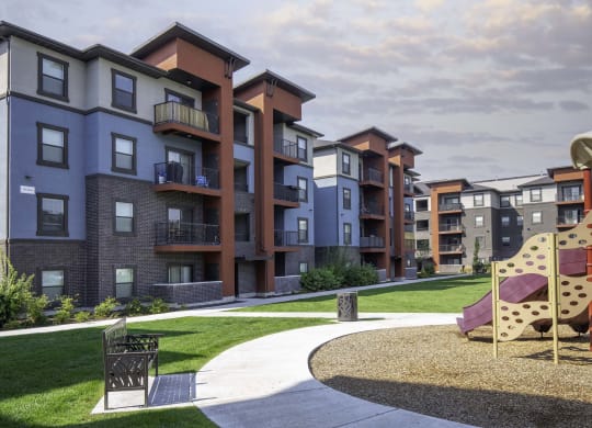 picture of an apartment building with a playground