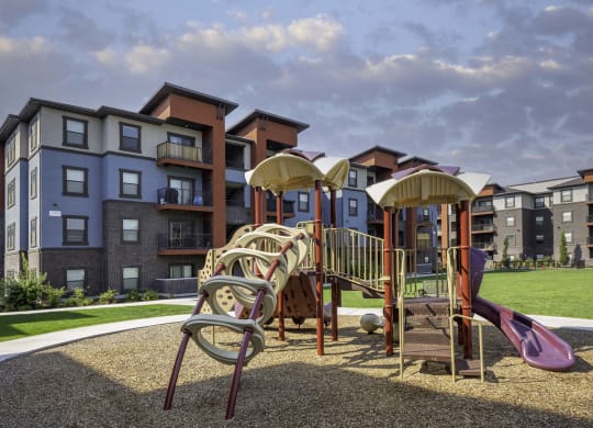 a playground at the flats at big tex apartments in san antonio, tx