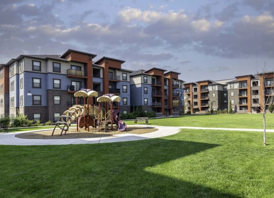 a playground at the flats at big tex apartments in san antonio, tx