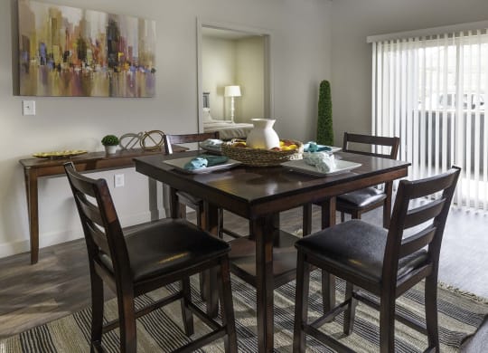 a dining room with a table and chairs