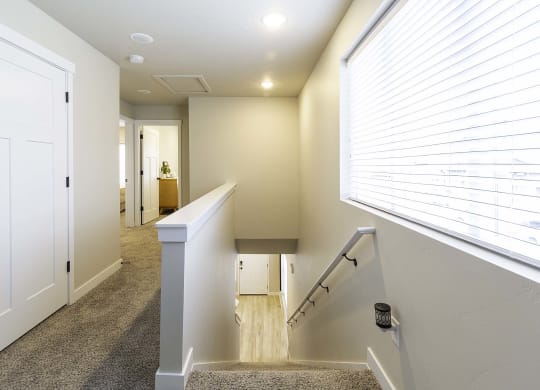 hallway with staircase at VALO at South Haven Farms townhomes in Payson, UT