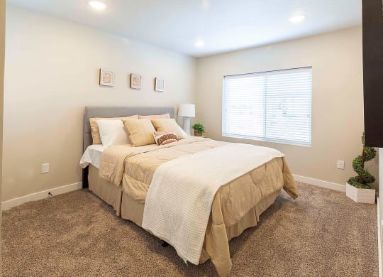 a bedroom at VALO at South Haven Farms townhomes in Payson, UT