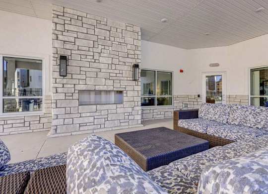 A stone fireplace is built into a wall in a living room.