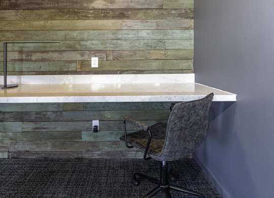 A chair is in front of a wooden wall.